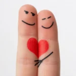 Two finger figures embracing a shared heart, symbolizing submission and unity in Christian marriage.